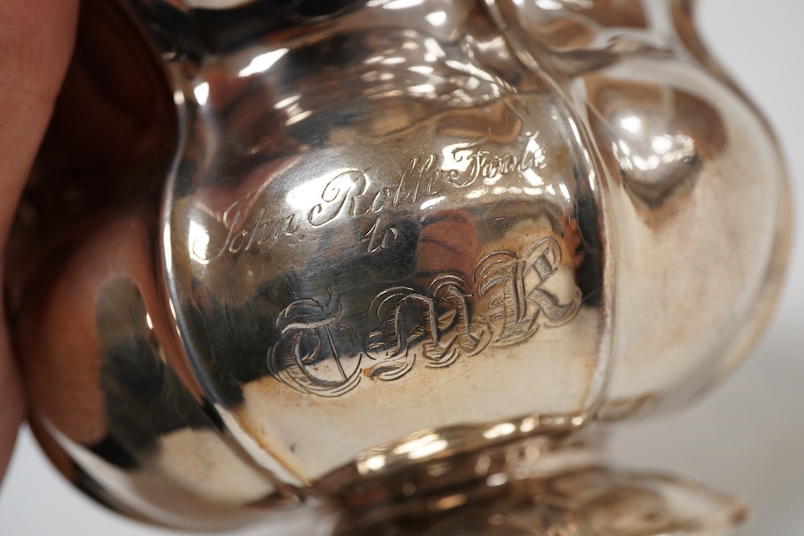 A George IV silver cream jug, with engraved monogram, by William, Charles and Henry Eley, London, 1824, height 10.5cm, 7.7oz.